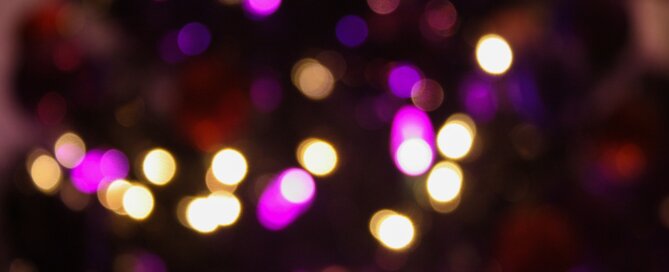 Blurred Christmas lights in purple and white