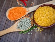 Three different types of raw lentils on table