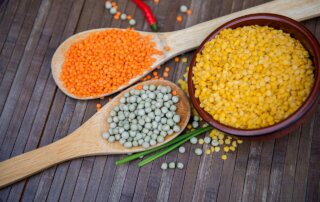 Three different types of raw lentils on table
