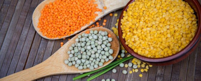Three different types of raw lentils on table