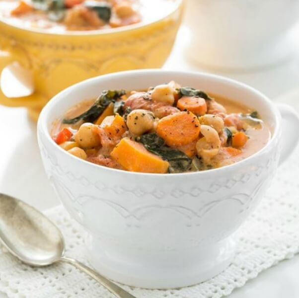 delicious vegan soup in a white bowl on a white tablecloth