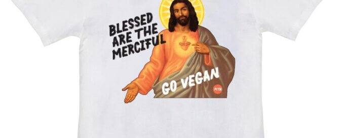 white short sleeve T-shirt with Jesus holding out his hand and text that reads 'Blessed are the Merciful'