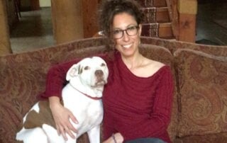 Lulu and Melissa Karpel sitting on couch
