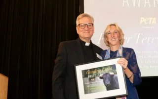 Fr. Terry Martin and Ingrid at award ceremony