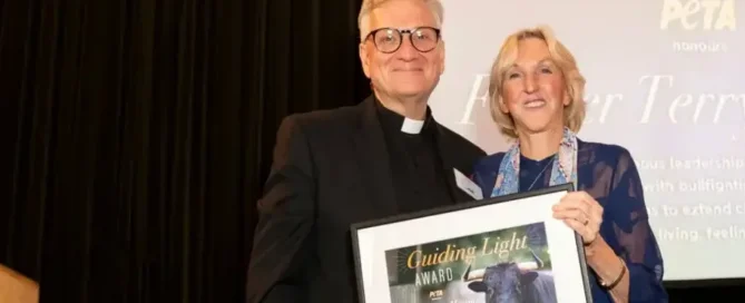 Fr. Terry Martin and Ingrid at award ceremony