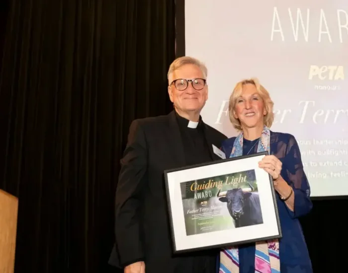 Fr. Terry Martin and Ingrid at award ceremony